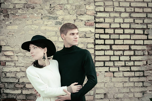 istock unusual young couple love in spring with brick wall 465377580