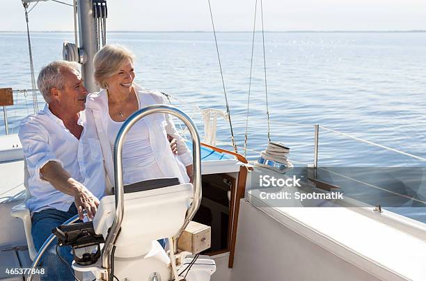 Happy Senior Couple Sailing Yacht Or Sail Boat Stock Photo - Download Image Now - Senior Adult, Wealth, Nautical Vessel