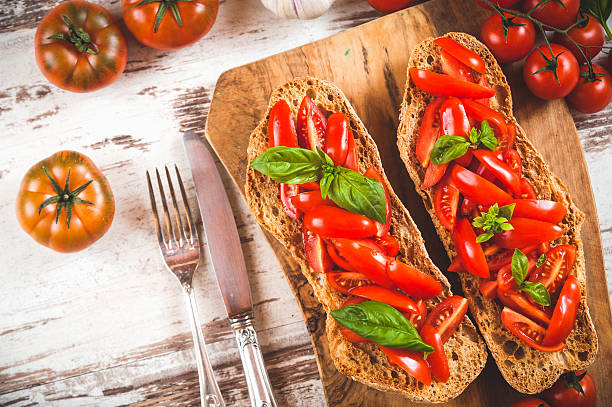 istock Italian starter, bruschetta with Sicilian red fresh tomato on a 465377926