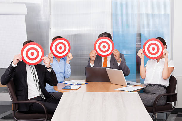 istock Businesspeople Holding Dartboard 465380709