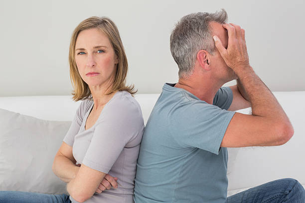 istock Unhappy couple not talking after an argument at home 465382144