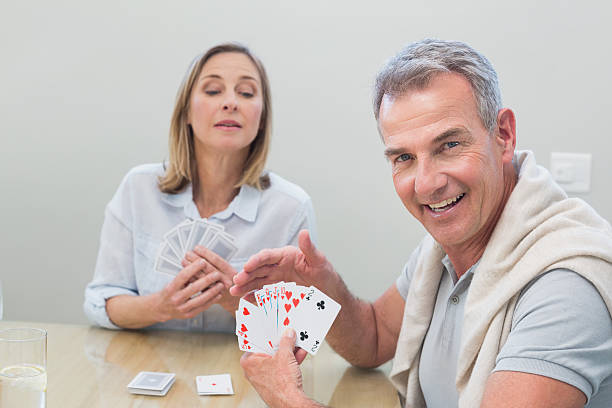istock Couple playing cards at home 465382276