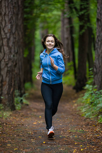 istock Young woman running outdoor 465382384