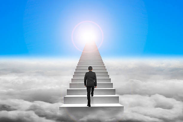 istock Businessman climbing the concrete stairs with blue sky sunlight 465382592