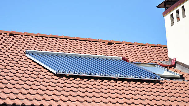 istock Solar water heater on ceramic tiled roof 465382918