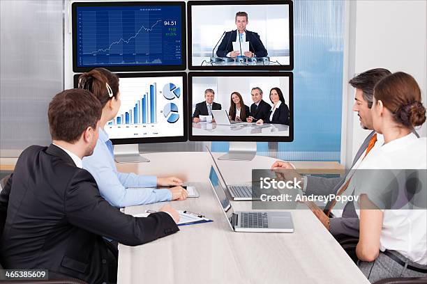 Businesspeople Looking At Computer Screen Stock Photo - Download Image Now - Cooperation, Digital Display, Domestic Room