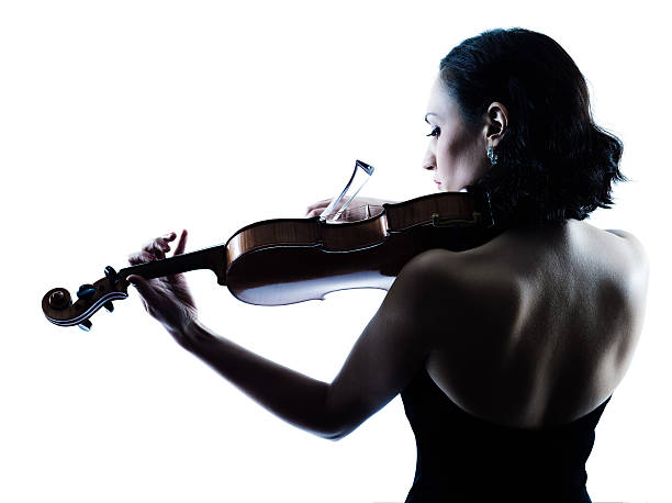 Backside of a female violinist playing her violin