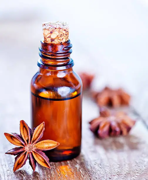 anise oil in bottle and on a table