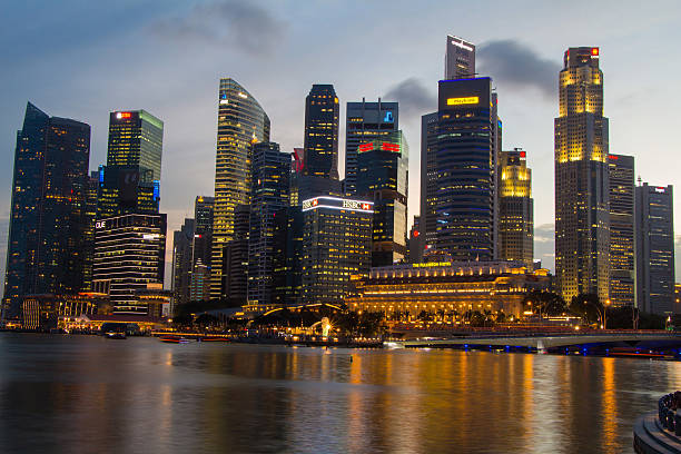 istock Singapore city scape at night with reflect 465386780