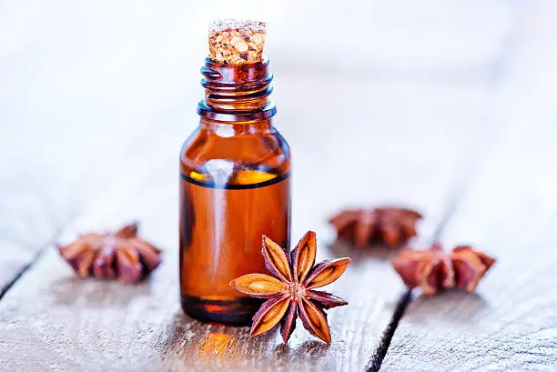 anise oil in bottle and on a table