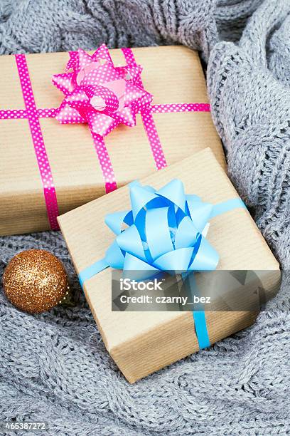 Christmas Presents On A Gray Knitted Background Stock Photo - Download Image Now - 2015, Backgrounds, Birthday
