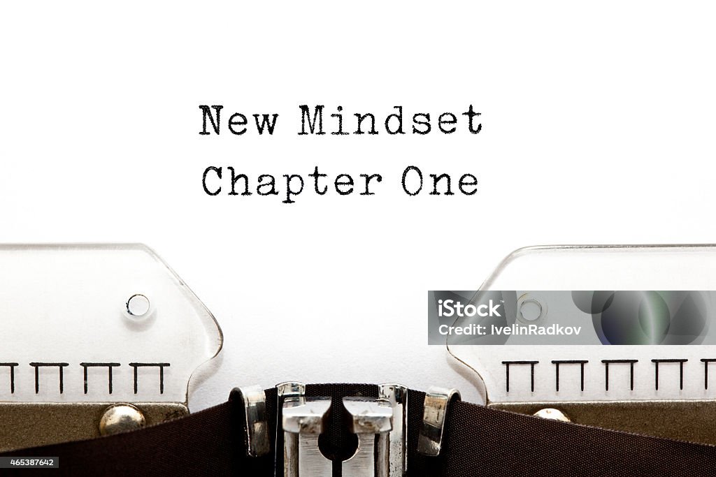 New Mindset Chapter One Typewriter New Mindset Chapter One printed on an old typewriter. Attitude Stock Photo