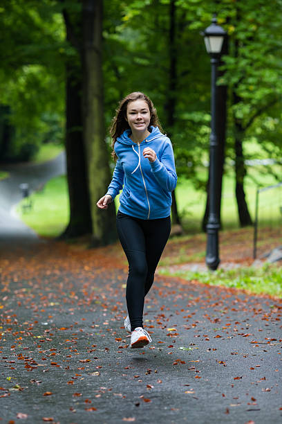 istock Young woman running outdoor 465387650