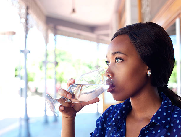 istock Young business woman drinking water 465387886