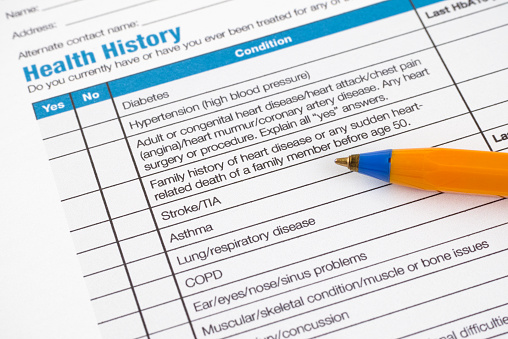 Health History form with pallpoint pen.