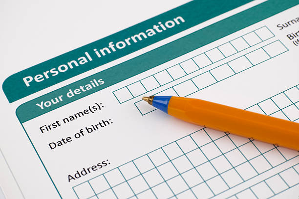 istock Paper with personal information and a pen 465388240