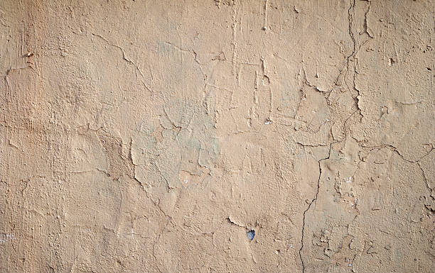 istock Texture of old wall covered with brown stucco 465388478