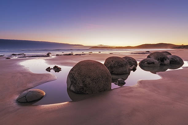 Famous Moeraki Boulders at low tide, Koekohe beach, New Zealand stock photo