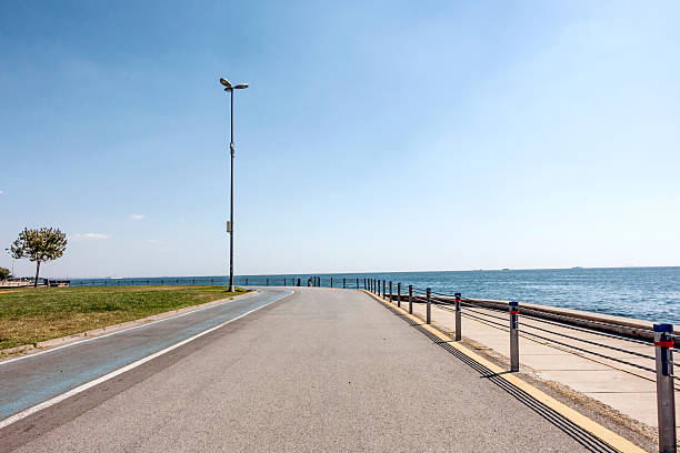 istock seaside curvy asphalt road in the park 465390364