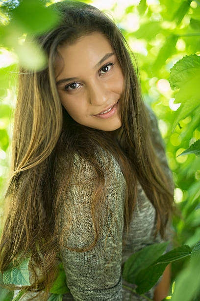 Close up portrait of a beautiful young girl at park