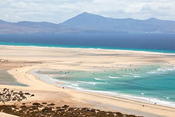 Beach and and the famous lagoon at low tide at Playas De Sotavento near Risco El Paso.