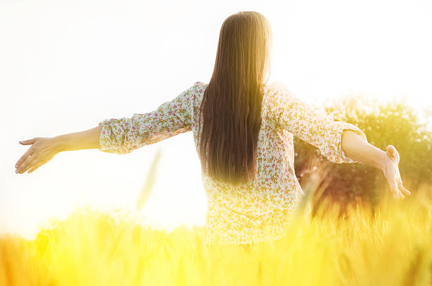 istock Young woman standing on the field 465391357