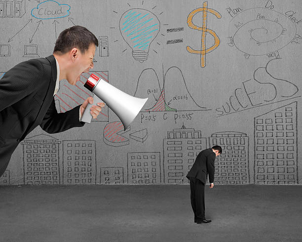 istock Businessman using megaphone yelling at his employee with doodles 465393124