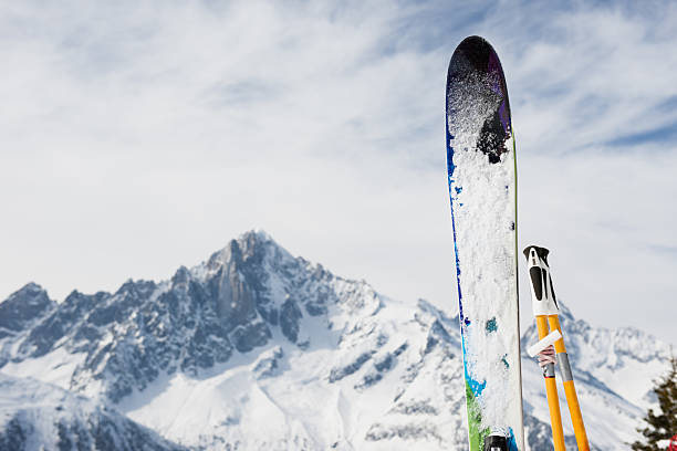 istock ski equipment on mountain background 465393139