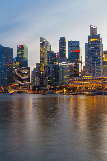 istock Singapore city scape at night with reflect 465393352
