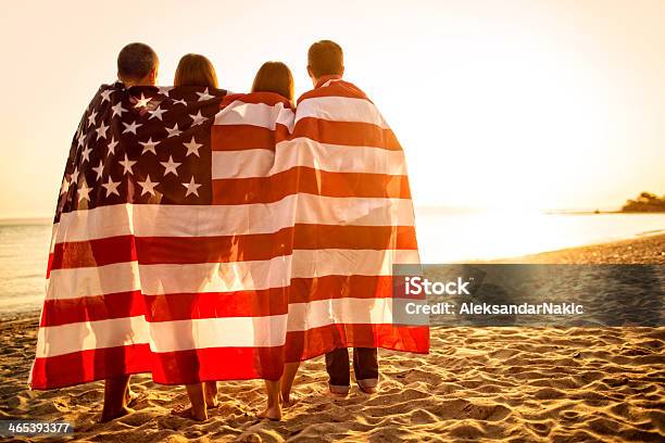 Proud Americans Stock Photo - Download Image Now - Fourth of July, Beach, American Flag