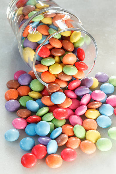 istock Glass with candies on marble 465393538