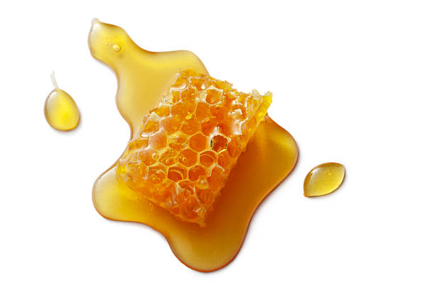 Flavouring: Honeycomb Isolated on White Background More Photos like this here... honey stock pictures, royalty-free photos & images