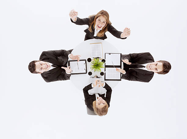 istock Businesswoman cheering while colleagues clap 465396554