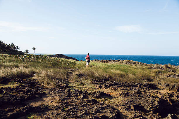 Hispanic man hiking at the beach in Puerto Rico