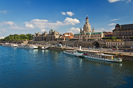  Cityscape of is a historic architectural ensemble in Dresden with Brühl's Terrace, Frauenkirche dome and Elbe river with the steamboat embankment. 