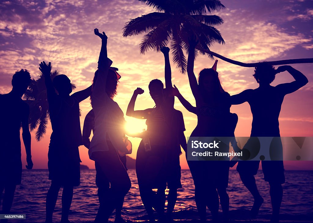 Silhouettes of people celebrating summer holiday on beach People Celebration Beach Party Summer Holiday Vacation Concept 2015 Stock Photo