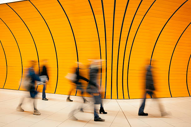istock Blurred Commuters in Futuristic Subway Station 465397518