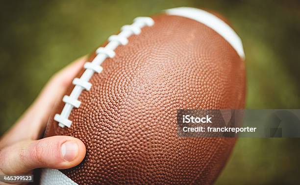 American Football Ball Stock Photo - Download Image Now - American Football - Ball, Human Hand, American Culture