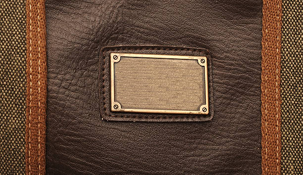 istock metal label on old black leather background 465400931