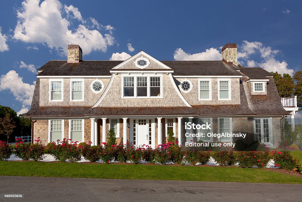 Luxury New England House, Chatham, Cape Cod, Massachusetts, USA. Chatham, MA, USA - September 15, 2014: Luxury New England House in Chatham, Cape Cod, Massachusetts, USA. The image is lit by the evening sun. Canon EF 24-105mm f4L IS lens. Chatham - Massachusetts Stock Photo