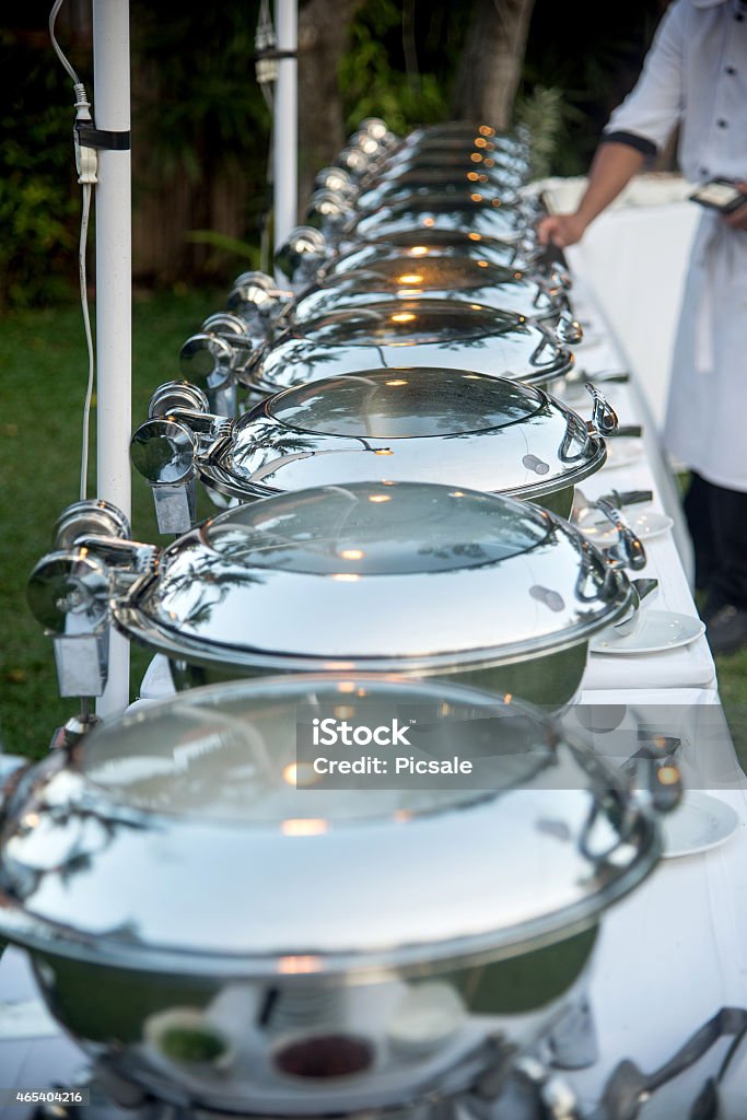 Buffet Table with Row of Food Service Steam Pans Buffet Stock Photo