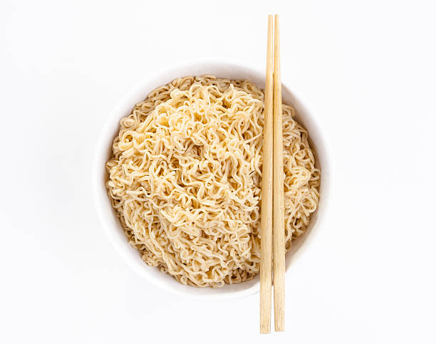istock Instant noodle in a bowl with chopsticks isolated 465404750