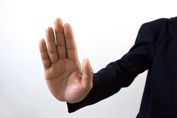 istock hand symbol that means stop on white background 465411124
