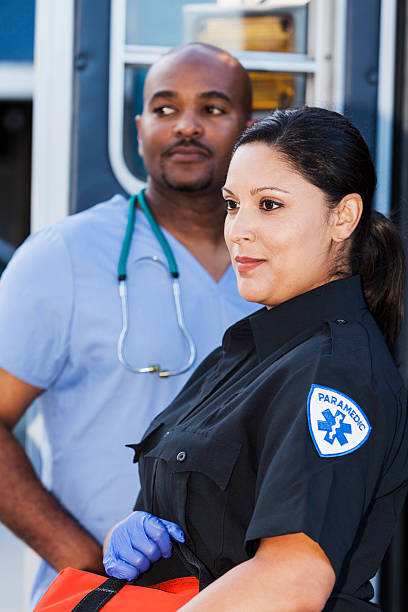 istock Paramedic and doctor next to ambulance 465413043