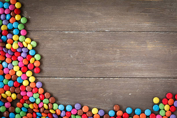 istock Frame From Candies on Wood 465413450