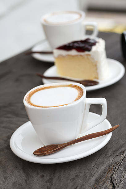 istock Cup of latte coffee with cake 465413595