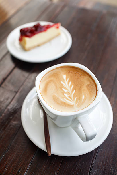 istock Cup of latte coffee with cake 465413611