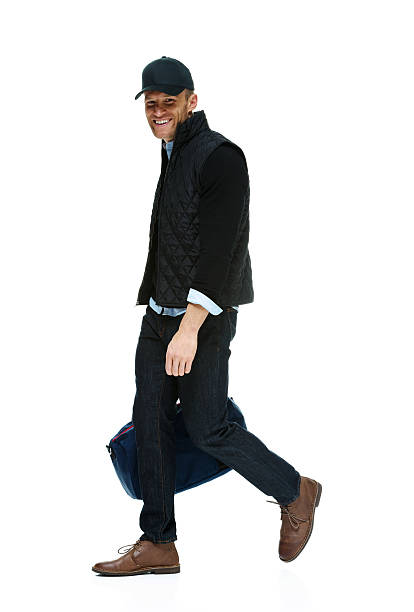 istock Smiling man walking with gym bag 465413655