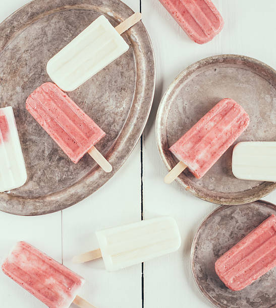istock Creamy and strawberry popsicles 465413836