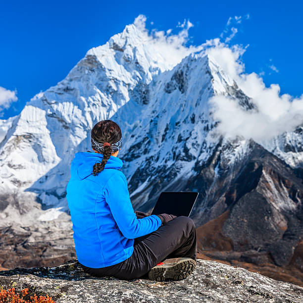 istock Woman is using laptop in Mount Everest National Park, Nepal 465416681